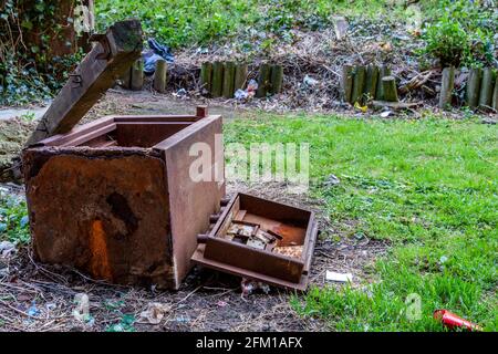 Heavy metal safe broken, dumped and rusted discarden near the town centre, Northampton, England, UK. Stock Photo