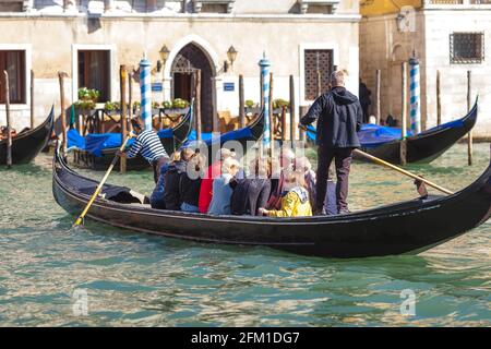 VENICE, ITALY - 07 October, 2017 Traghetto (ferry gondola) crossing Grand Canal in bright sunny day, Venice Stock Photo