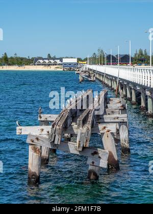 Busselton Jetty the longest timber-piled jetty in the southern hemisphere and a section of the original jetty, Western Australia Stock Photo