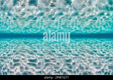 Underwater image of turquoise water with reaction on sea surface Stock Photo