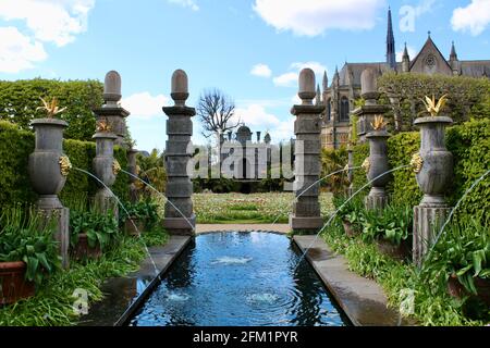 Arundel Castle Tulip Festival - 2021 - Ornamental water feature with cathedral in the background. Stock Photo