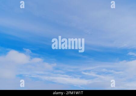 Abstract template with blue sky, white clouds and waxing half moon. Beauty of nature concept. Abstract natural background. Stock Photo