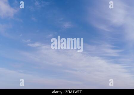 Abstract template with blue sky, white clouds and waxing half moon. Beauty of nature concept. Abstract natural background. Stock Photo