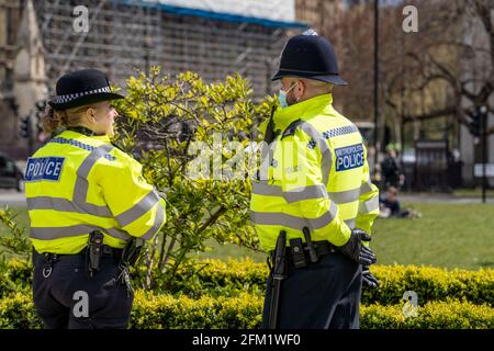 LONDON, UK – 02nd May 2021: Metropolitan Police Officers in uniform stand at Parliament Square waiting for Kill the Bill and NUG support protesters Stock Photo