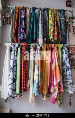 A rack of scarves on display in a store Stock Photo