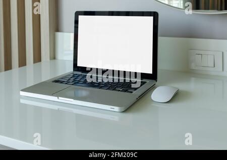 computer laptop mock up and mouse white blank screen on table. Stock Photo