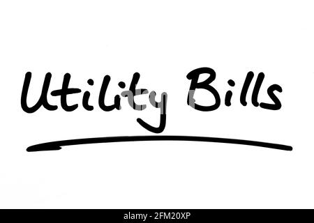Utility Bills, handwritten on a white background. Stock Photo