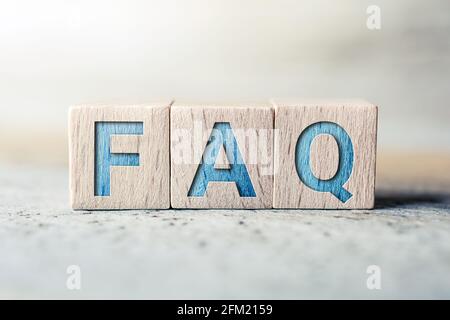 FAQ Written On Wooden Blocks On A Board - Need Help Concept Stock Photo