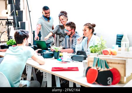 Young people employees group working at computer in startup studio - Human resources business and teamwork concept on laptop brainstorming time Stock Photo