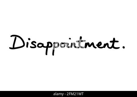 Disappointment, handwritten on a white background. Stock Photo