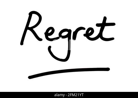 Regret, handwritten on a white background. Stock Photo