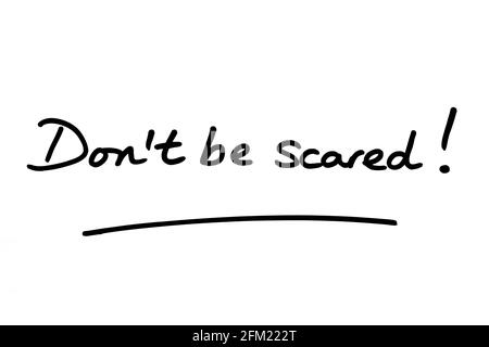 Dont be scared! handwritten on a white background. Stock Photo