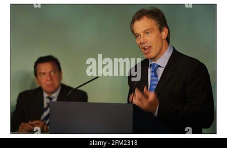 Tony Blair addresses a press conf at the end of the Progressive Governance Summit at Penny Hill Park in Bagshot ,Surrey. Listened to by Chancellor Gerhard Schroeder of Germany.pic David Sandison 14/7/2003 Stock Photo