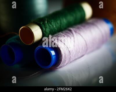 Sewing threads multicolored background closeup, selective focus, macro Stock Photo