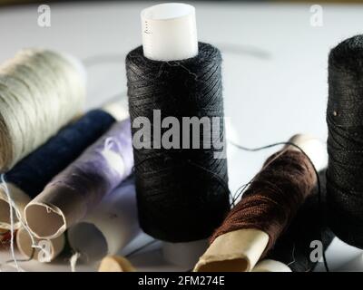 Sewing threads multicolored background closeup, selective focus, macro Stock Photo