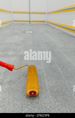 Selective focusing on the roll of bubble needles on the polished cement floor Stock Photo