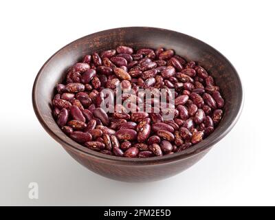 Red pinto beans in ceramic bowl isolated on white background with clipping path Stock Photo