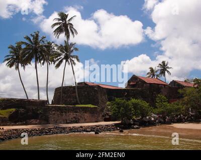The old, stone Black Fort with palm trees under a hot, tropical midday sun. In Galle, Sri Lanka. Stock Photo