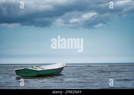Small Fishing Boat With Fishing Net And Equipment Stock Photo