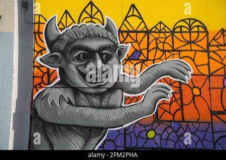 Legend of the Lincoln Imp, Lincoln Cathedral, locations throughout Lincolnshire, old legend, devil sent his imps, old store front, graffiti colourful. Stock Photo