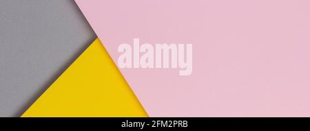 Creative abstract yellow, pink and gray color geometric paper compositon background, top view Stock Photo