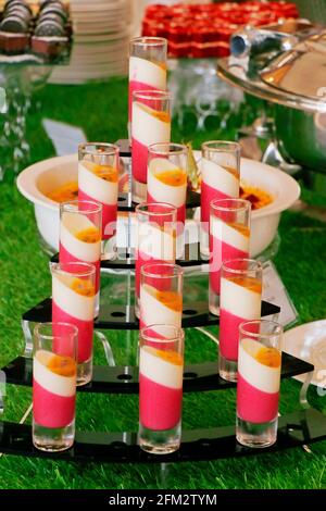 italian speciality dessert panna cotta in small glass jars Stock Photo