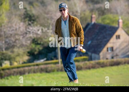 Actor Benedict Cumberbatch enjoys a bottle of cider on Burrow Hill in Somerset on Saturday evening after the final day of filming for Doctor Strange 2. Stock Photo