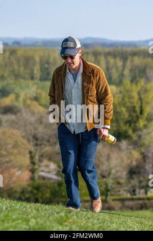 Actor Benedict Cumberbatch enjoys a bottle of cider on Burrow Hill in Somerset on Saturday evening after the final day of filming for Doctor Strange 2. Stock Photo