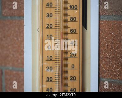 Thermometer thermostat instrument to measure air temperature . Blank space  for writing . Thermometer on green background. Measuring temperature. Air t  Stock Photo - Alamy