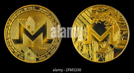 Monero crypto coin isolated on black background, both side on golden cryptocurrency coin, close-up view photo Stock Photo