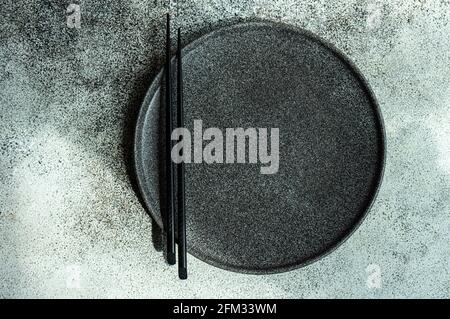 Overhead view of a modern minimalistic Asian place setting on a table Stock Photo