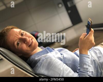 Traveling business man relaxing in a VIP lounge at the airport Stock Photo
