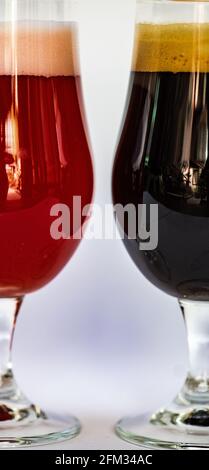 Close-up of two glasses of different craft beers on a table Stock Photo