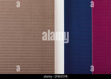 Brown, purple and blue corrugated paper texture. Geometric shapes and lines. Minimalist background. Flat lay. Copy space. Stock Photo