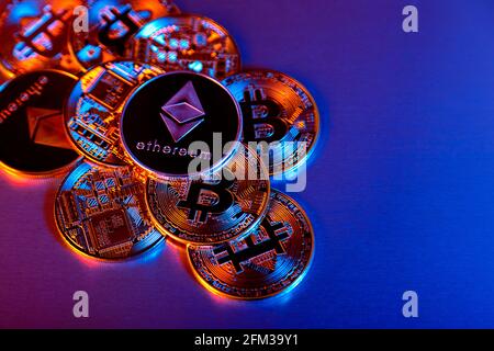 Cryptocurrency bitcoin and ethereum (ether) token coins background Stock Photo