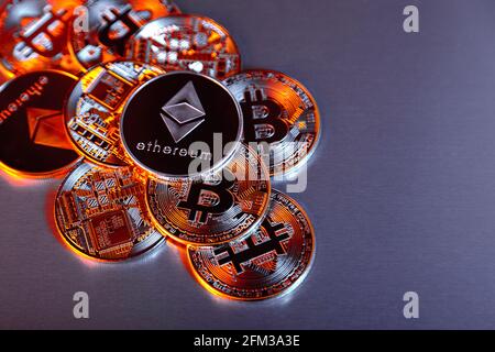 Cryptocurrency bitcoin and ethereum (ether) token coins background Stock Photo