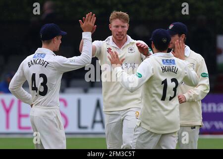 Liam Norwell of Gloucestershire (C) is congratulated by his team mates after taking the wicket of Ravi Bopara during Essex CCC vs Gloucestershire CCC, Stock Photo