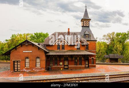 Point of Rocks is a small town on the border of Virginia and Maryland, with historic buildings. Footage shows historic brick railway station build in Stock Photo