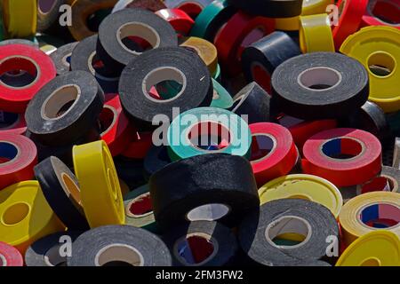 Pile of colorful electrical insulating tape rolls sold on market Stock Photo