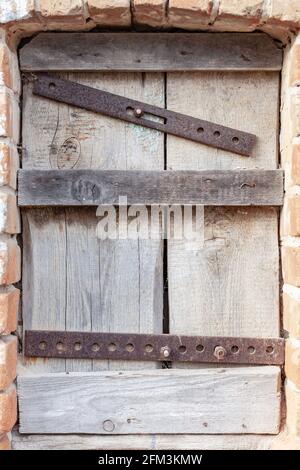 boarded-up window close up, place under the text Stock Photo