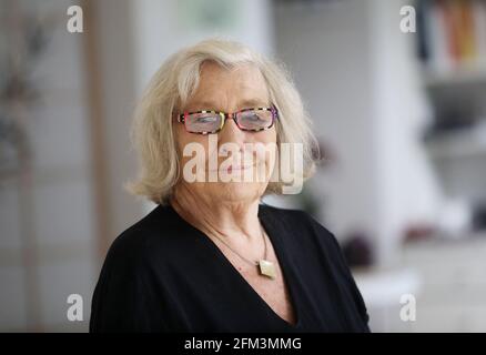 Cologne, Germany. 05th May, 2021. Carmen Thomas, presenter, sits in a yoga studio. Carmen Thomas is unforgotten as the presenter of the cult show 'Hallo Ü-Wagen'. Now she turns 75 - and worries about the long-term effects of Corona. Credit: Oliver Berg/dpa/Alamy Live News Stock Photo