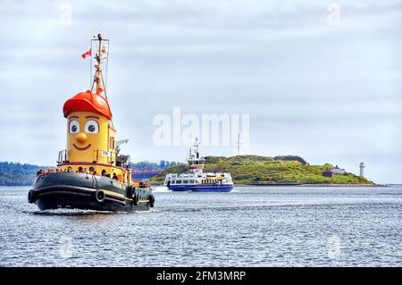 Halifax, Canada - September 20, 2009:  Theodore Tugboat, the tour boat inspired by a children’s TV show and the Dartmouth Ferry in Halifax Harbour Stock Photo