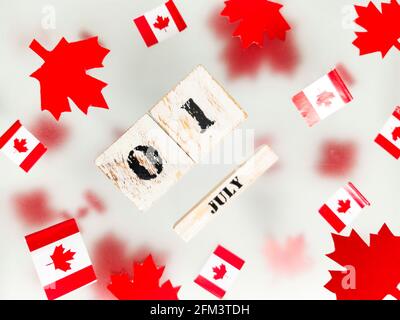 July 1, Happy Canada Day. Red maple leaves and flags on a transparent foggy background. A multi-tiered photo, a Memorial day card. The concept of free Stock Photo