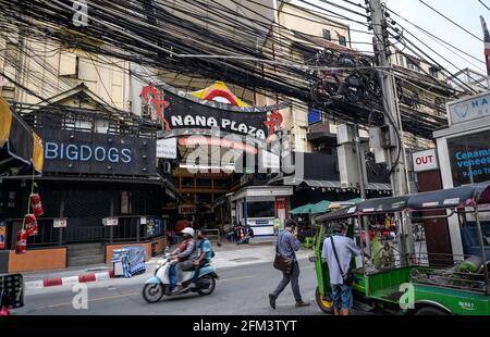 Bangkok, Thailand. 05th May, 2021. View of the entrance to the internationally famous Soi Cowboy go go bar entertainment street. Bangkok night life entertainment venues, bars, pubs and restaurants are closed in the designated red zone. A partial lockdown has been imposed for 2 weeks during May 3 -17, 2021, due to a recent upsurge of the Covid C-19 virus outbreak in the capital. Credit: SOPA Images Limited/Alamy Live News Stock Photo