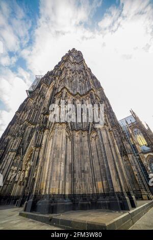 Cologne, Germany - July 07, 2018: Facade of the Cathedral Church of Saint Peter, Catholic cathedral in Cologne, bottom view Stock Photo