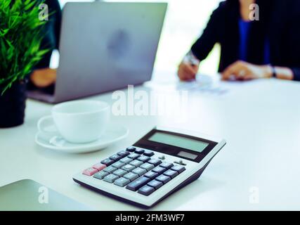 Business analysts make decisions about the US economy that affect future operations of the company. Stock Photo