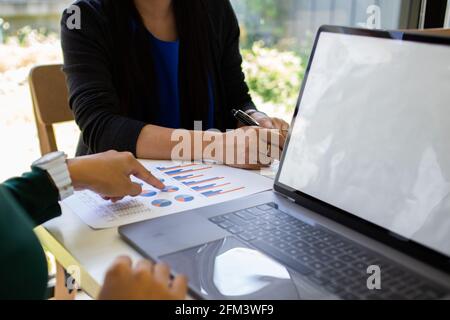 Business analysts make decisions about the US economy that affect future operations of the company. Stock Photo