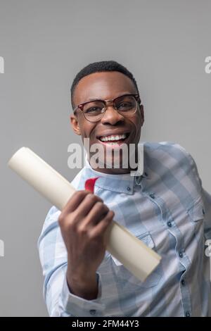Energetic happy dark skinned man with glasses Stock Photo