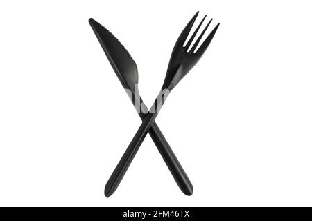 Black plastic knife and fork isolated on white background. Disposable tableware set isolated with clipping path. Stock Photo
