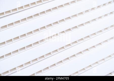 Construction vinyl siding panels pattern. House covered with white plastic vinyl siding. Vinyl siding wall surfacel texture background isolated Stock Photo